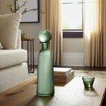 Glass Vase with Vertical Ribbed Detailing and Round Stopper Accent Aligned to Coastal Trend for Modern Decorative Display in Contemporary Interior Settings. - Image 3